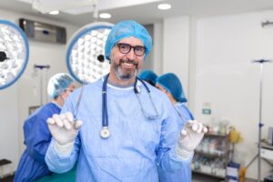 Male surgeon standing in operating room and with instruments