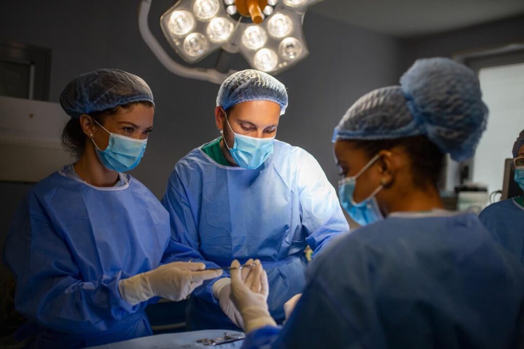 Surgical team performing an operation in a modern operating room