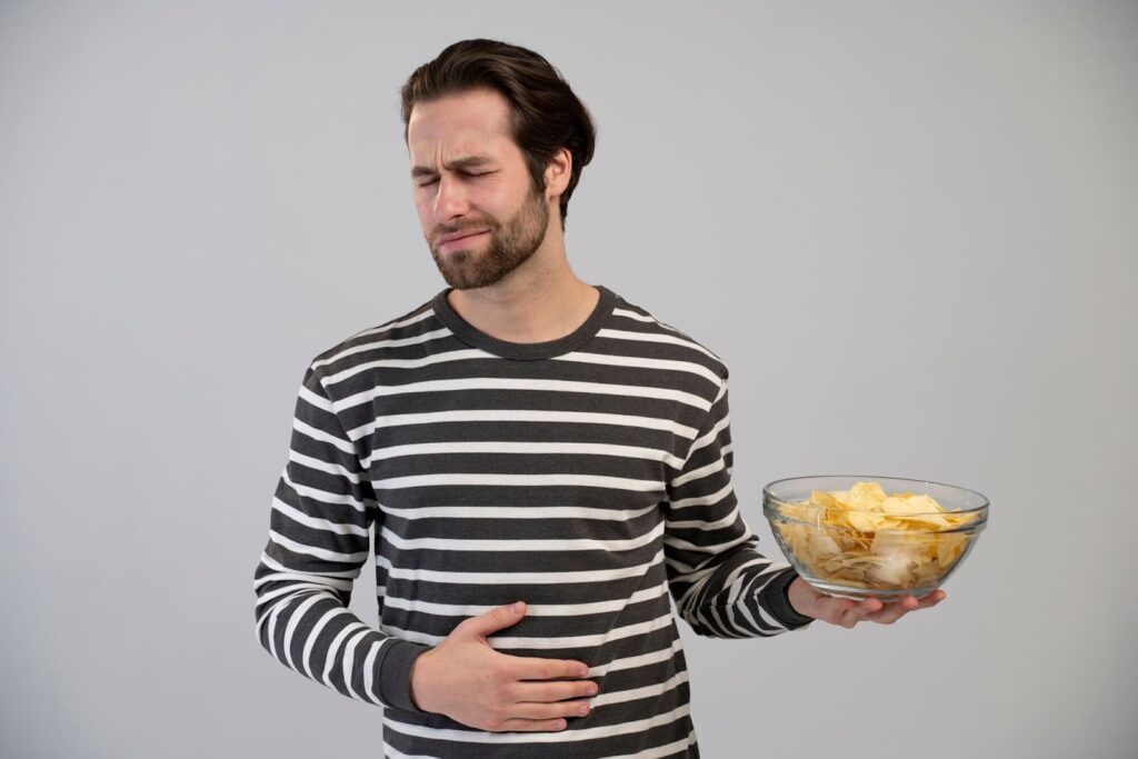 A person with an eating disorder experiences stomach pain